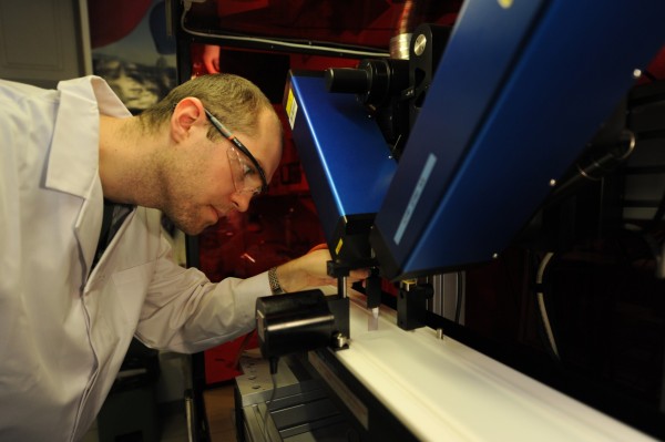 Photo gallery - category: Research - Dr Volodymyr Sashuk from the IPC PAS deposits an ordered layer of gold nanoparticles on a glass plate.